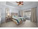 Serene main bedroom with a comfortable bed, stylish decor, and sliding doors leading to a private balcony at 1551 Spinnaker Dr. # 5312, North Myrtle Beach, SC 29582