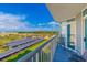 Balcony view of parking area featuring outdoor chairs, railing and blue skies at 161 Sea Watch Dr. # 601, Myrtle Beach, SC 29572