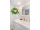 Bright bathroom features a white vanity with brushed nickel fixtures, mirror, and shiplap walls at 161 Sea Watch Dr. # 601, Myrtle Beach, SC 29572