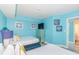 Spacious bedroom with twin beds, television, and calming coastal-themed decor at 161 Sea Watch Dr. # 601, Myrtle Beach, SC 29572
