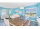 Dining room area featuring chandelier, table, benches and view of the living room and kitchen at 161 Sea Watch Dr. # 601, Myrtle Beach, SC 29572