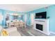 Open living and dining area featuring fireplace, TV, dining table and view of the kitchen at 161 Sea Watch Dr. # 601, Myrtle Beach, SC 29572