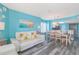Open living and dining area featuring couches, dining table and view of the kitchen at 161 Sea Watch Dr. # 601, Myrtle Beach, SC 29572