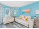 Bright living room featuring couches, side tables, ocean painting and view of the window at 161 Sea Watch Dr. # 601, Myrtle Beach, SC 29572