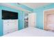 Bedroom featuring a television, closet, and ensuite bathroom providing both privacy and convenience at 161 Sea Watch Dr. # 601, Myrtle Beach, SC 29572