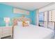 Bright bedroom with balcony access and decor providing a relaxing, tranquil space at 161 Sea Watch Dr. # 601, Myrtle Beach, SC 29572