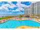 Large outdoor pool with a beach view at this oceanfront condo community with ample seating and a bar at 161 Sea Watch Dr. # 601, Myrtle Beach, SC 29572