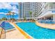 Relaxing outdoor pool with plenty of seating, sun and shade for residents and guests at 161 Sea Watch Dr. # 601, Myrtle Beach, SC 29572