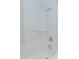 Clean, all-white shower features built-in shelving and modern fixtures at 161 Sea Watch Dr. # 601, Myrtle Beach, SC 29572