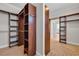 Walk-in closet with dark wood shelving and ample storage, conveniently arranged for organization at 1619 Eastover Ln., North Myrtle Beach, SC 29582