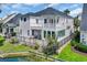 Two-story home featuring dual balconies, a covered patio, fenced backyard and waterfront views at 1619 Eastover Ln., North Myrtle Beach, SC 29582