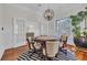 Stylish game room with a poker table, comfortable seating, and large windows with natural light at 1619 Eastover Ln., North Myrtle Beach, SC 29582