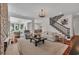 Spacious living room featuring hardwood floors, staircase, and open access to other areas of the house at 1619 Eastover Ln., North Myrtle Beach, SC 29582