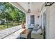 Relax on the covered patio, complete with comfortable seating and stylish decor for outdoor enjoyment at 1619 Eastover Ln., North Myrtle Beach, SC 29582