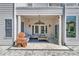 Charming covered patio featuring cozy seating, a ceiling fan, and elegant French doors for seamless indoor-outdoor living at 1619 Eastover Ln., North Myrtle Beach, SC 29582