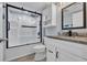 Modern bathroom with stylish vanity, elegant fixtures and a glass-enclosed shower at 1625 S Ocean Blvd. # 211, North Myrtle Beach, SC 29582