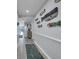 Hallway decorated with nautical-themed artwork leading to bright living area at 1625 S Ocean Blvd. # 211, North Myrtle Beach, SC 29582