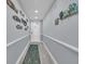 Hallway decorated with charming nautical-themed decor leading to the front door at 1625 S Ocean Blvd. # 211, North Myrtle Beach, SC 29582