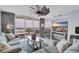 Cozy living room with balcony overlooking the beach featuring stylish decor and a ceiling fan at 1625 S Ocean Blvd. # 211, North Myrtle Beach, SC 29582