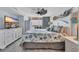 Beautiful bedroom features coastal decor, wood-look floors, dresser, and balcony access at 1625 S Ocean Blvd. # 211, North Myrtle Beach, SC 29582