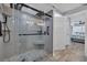 Modern shower with glass door, mosaic tiles, and a built-in seat at 1625 S Ocean Blvd. # 211, North Myrtle Beach, SC 29582
