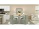 Stylish dining area with modern table, chairs, decorative lighting, and beachy decor at 1740 Hunting Harris Ct # 9, Ocean Isle Beach, NC 28469