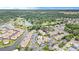Community aerial view showcasing a pool, golf course, and lake surrounded by lush green trees at 1900 Duffy St. # L4, North Myrtle Beach, SC 29582