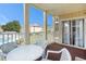 Relaxing balcony overlooking the pool and manicured lawn in this outdoor seating area at 1900 Duffy St. # L4, North Myrtle Beach, SC 29582