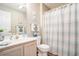 Cozy bathroom with a shower, towel racks, and a charming vanity with a sink at 1900 Duffy St. # L4, North Myrtle Beach, SC 29582