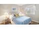Charming bedroom with nautical decor, window, and a comfortable-looking blue striped bedspread at 1900 Duffy St. # L4, North Myrtle Beach, SC 29582