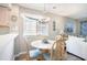 Cozy dining area featuring a round table with four chairs and ample natural light at 1900 Duffy St. # L4, North Myrtle Beach, SC 29582