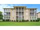 A multi-story condo building featuring screened-in balconies and well-manicured lawns and landscaping at 1900 Duffy St. # L4, North Myrtle Beach, SC 29582