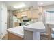 Bright kitchen featuring white countertops, light wood cabinets, and modern appliances at 1900 Duffy St. # L4, North Myrtle Beach, SC 29582