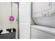 Laundry room with stackable washer and dryer, offering convenience and functionality at 1900 Duffy St. # L4, North Myrtle Beach, SC 29582
