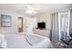Bright main bedroom featuring ceiling fan, balcony access, and neutral decor at 1900 Duffy St. # L4, North Myrtle Beach, SC 29582
