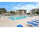 Inviting pool area with clear blue water, surrounded by lounge chairs and lush landscaping at 1900 Duffy St. # L4, North Myrtle Beach, SC 29582