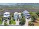 Aerial view of two beautiful homes next to a lush marsh with ocean views at 191 Grackle Ln., Pawleys Island, SC 29585
