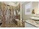 Luxurious bathroom featuring a tiled shower, sleek fixtures, and a modern vanity at 191 Grackle Ln., Pawleys Island, SC 29585
