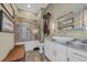 Elegant bathroom features a tiled shower, granite countertops, and stylish fixtures at 191 Grackle Ln., Pawleys Island, SC 29585