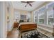 Comfortable bedroom with a wooden bed frame, shutters, and natural light at 191 Grackle Ln., Pawleys Island, SC 29585