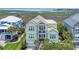 Charming two-story home with a lush green lawn and inviting front porch overlooking the serene marsh and ocean beyond at 191 Grackle Ln., Pawleys Island, SC 29585