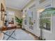 Elegant entryway with a view to an outside balcony, complemented by stylish furnishings and natural light at 191 Grackle Ln., Pawleys Island, SC 29585