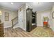 Mud room entry area with bench seating, wall decor, hardwood floors and staircase at 191 Grackle Ln., Pawleys Island, SC 29585