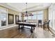 Spacious game room with a billiards table, ample natural light, and comfortable seating at 191 Grackle Ln., Pawleys Island, SC 29585