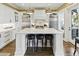 Stylish kitchen with a large central island, sleek countertops, and premium stainless steel appliances creating a modern culinary space at 191 Grackle Ln., Pawleys Island, SC 29585