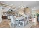 Bright and spacious living room with a decorative fireplace, elegant dining area and a staircase leading up at 191 Grackle Ln., Pawleys Island, SC 29585