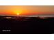 Sunset over a marsh and waterway with a boardwalk leading to an observation deck at 191 Grackle Ln., Pawleys Island, SC 29585