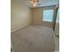 Cozy bedroom featuring a ceiling fan, carpet flooring, and a window at 1980 Bent Grass Dr. # F, Surfside Beach, SC 29575