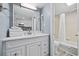 Bright bathroom featuring a white vanity, well-lit mirror, and a shower/bathtub combination at 2001 S Ocean Blvd. # 815, Myrtle Beach, SC 29577