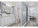 Clean and modern bathroom with a white vanity, sink, and a clear view into the adjacent rooms at 2001 S Ocean Blvd. # 815, Myrtle Beach, SC 29577